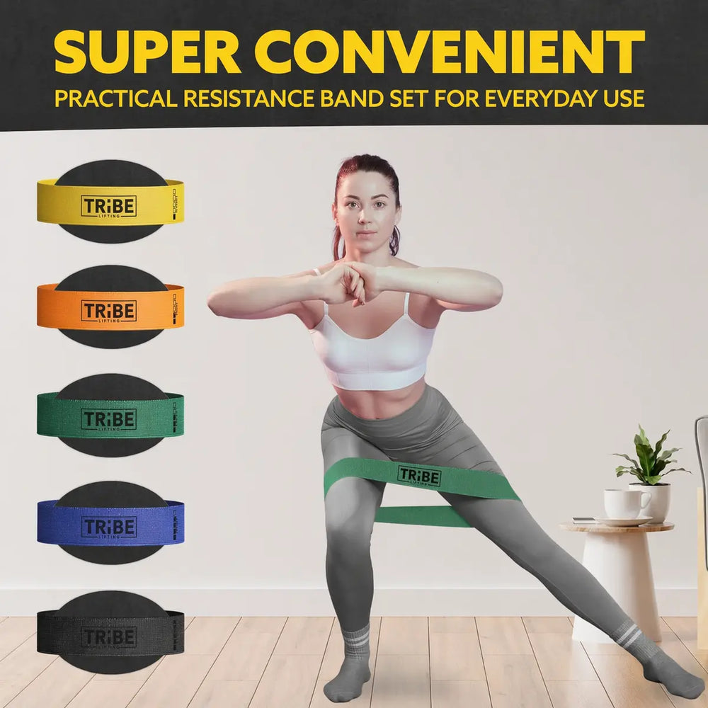 Woman demonstrating a side lunge with the green medium fabric resistance band from the Tribe Lifting resistance bands set of 5 at home