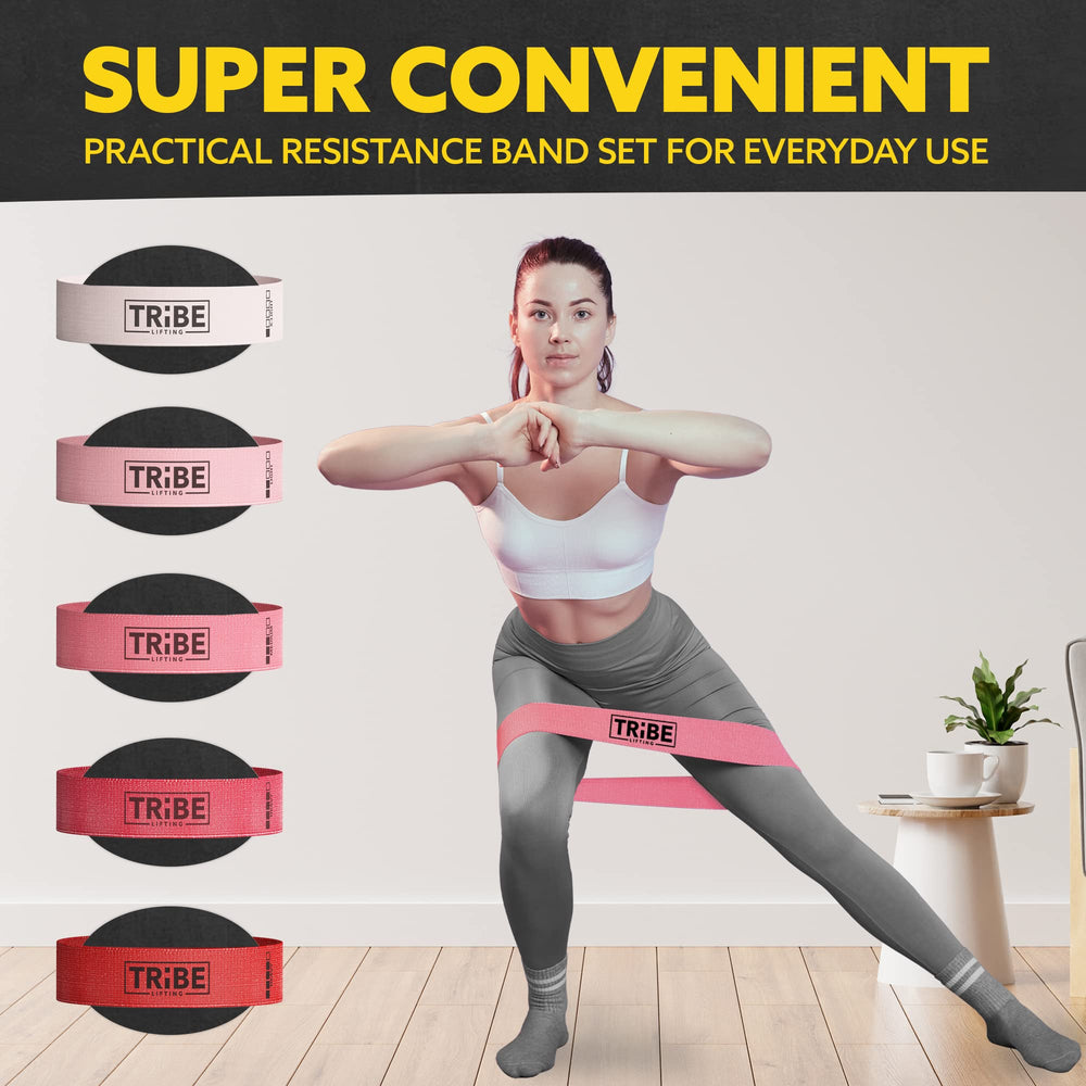 Woman demonstrating a side lunge with the pink fabric resistance band from the Tribe Lifting resistance bands set of 5 at home