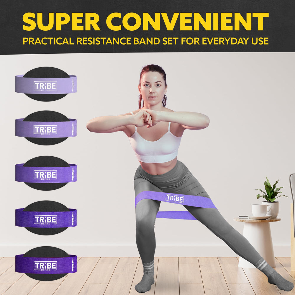 Woman demonstrating a side lunge with the purple fabric resistance band from the Tribe Lifting resistance bands set of 5 at home