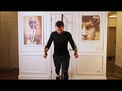 Man using a door anchor for resistance bands during a chest fly exercise at home