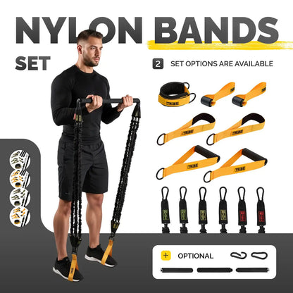 Man using the Tribe Lifting nylon resistance bands set with handles, ankle straps, tube bands, carabiners, and optional bar attachments for full body strength training workouts.