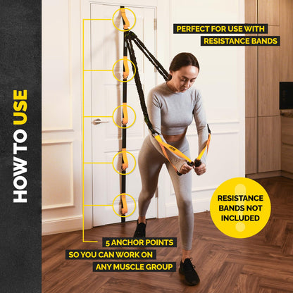 Woman using the Tribe Lifting door anchor for resistance bands at home with 5 anchor points for full body workouts