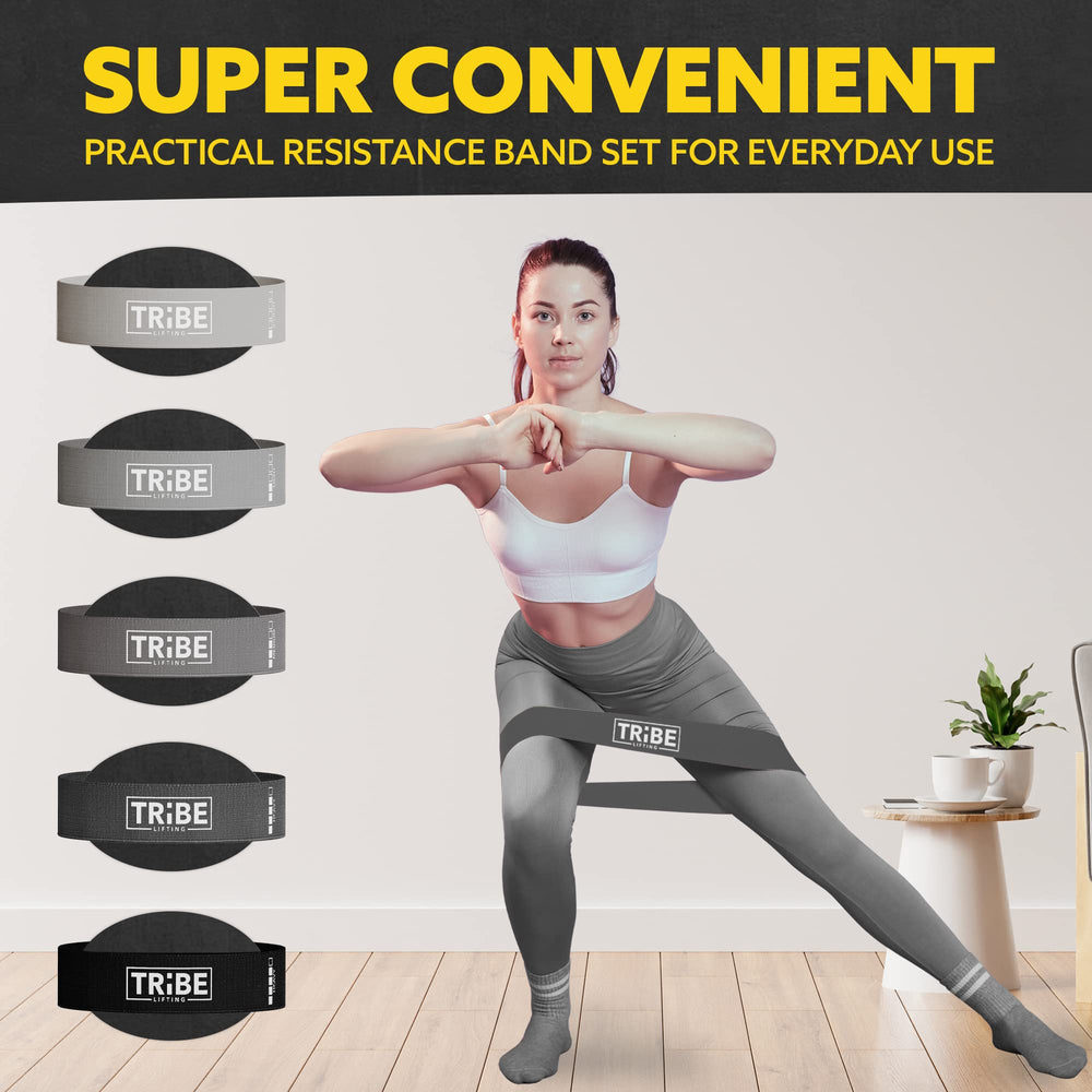 Woman demonstrating a side lunge with the gray fabric resistance band from the Tribe Lifting resistance bands set of 5 at home