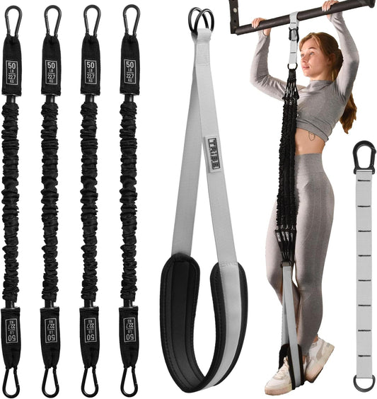 Woman using the gray Tribe Lifting pull-up assistance set with four 50 lb resistance bands, padded foot strap, adjustable extension strap, and pull-up bar attachment for assisted pull-up training.