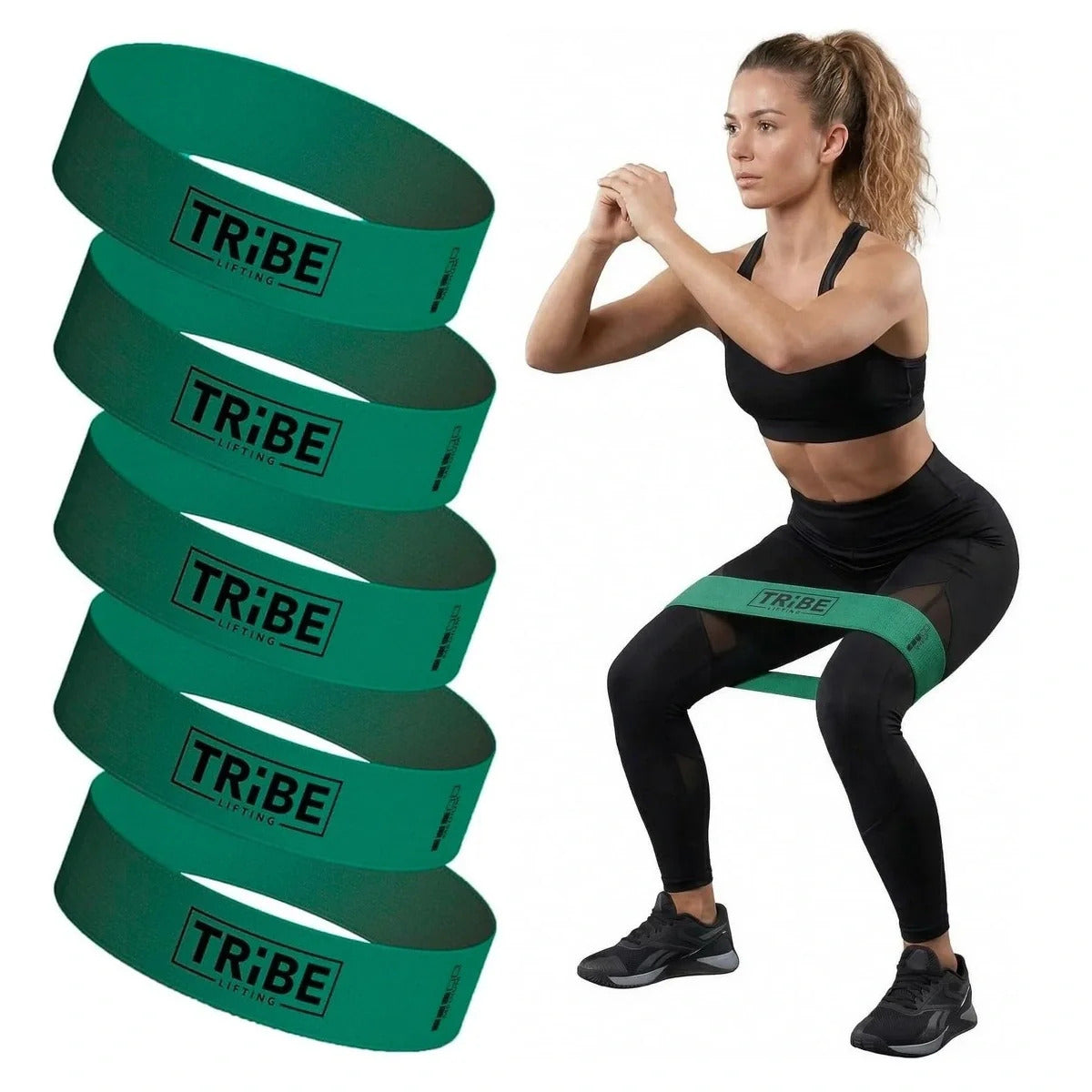 Woman demonstrating a squat with the green medium fabric resistance band from the Tribe Lifting resistance bands set of 5