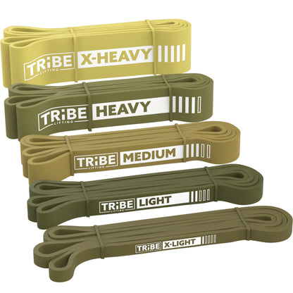 Green Tribe Lifting latex resistance bands set with five loop bands labeled X-Light, Light, Medium, Heavy, and X-Heavy for progressive strength training.