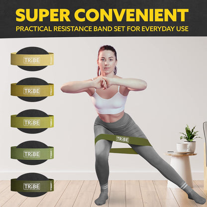 Woman demonstrating a side lunge with the military green fabric resistance band from the Tribe Lifting resistance bands set of 5 at home