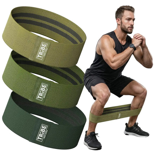 Man demonstrating a squat with the Tribe Lifting military green premium resistance bands set 3