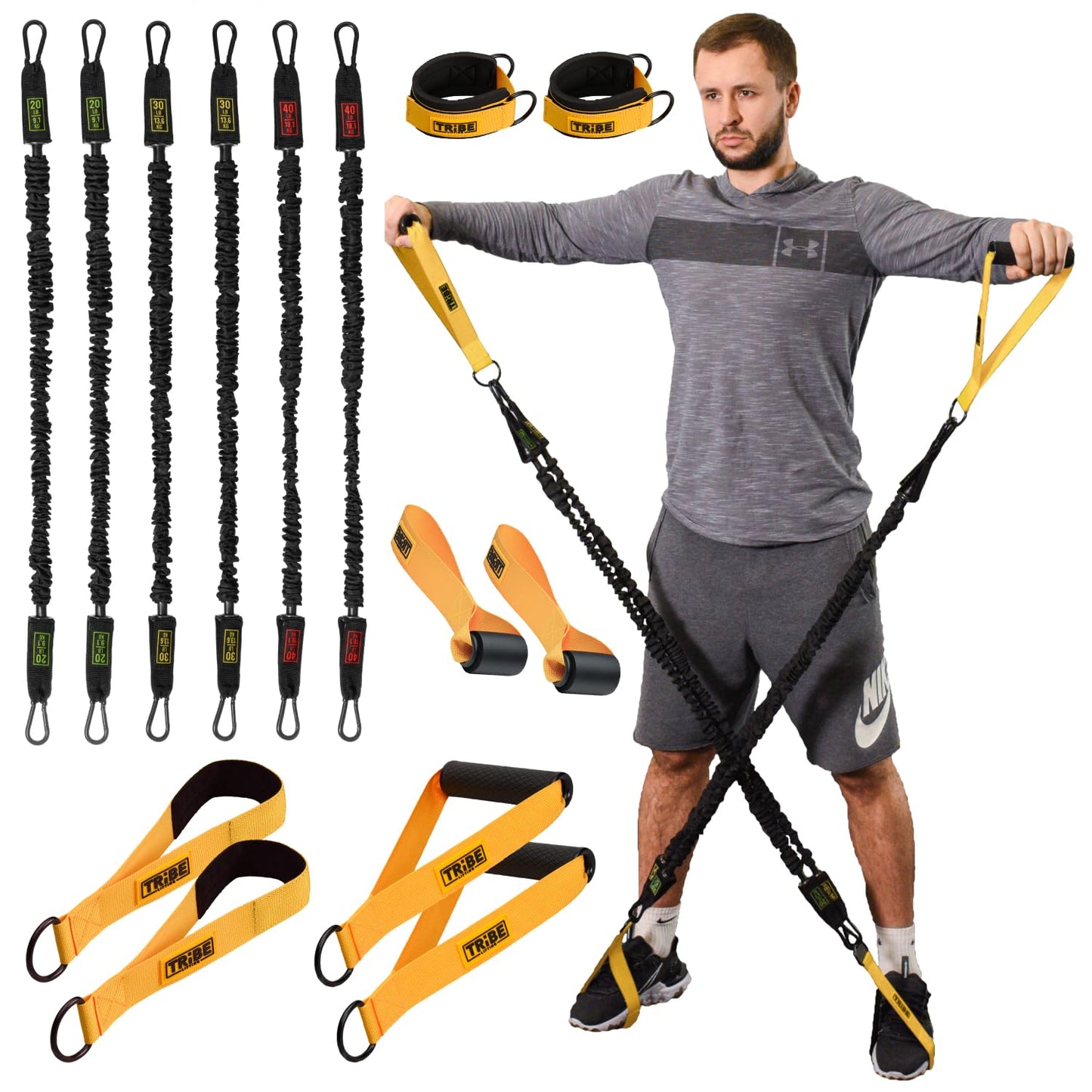 Man using the Tribe Lifting nylon resistance bands set with handles and foot straps, shown with tube bands, ankle straps, door anchors, and workout attachments for full body strength training.