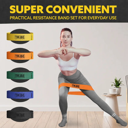 Woman demonstrating a side lunge with the orange light fabric resistance band from the Tribe Lifting resistance bands set of 5 at home