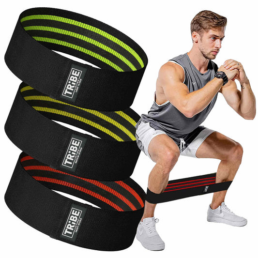 Man demonstrating a squat with the Tribe Lifting premium resistance bands set 3