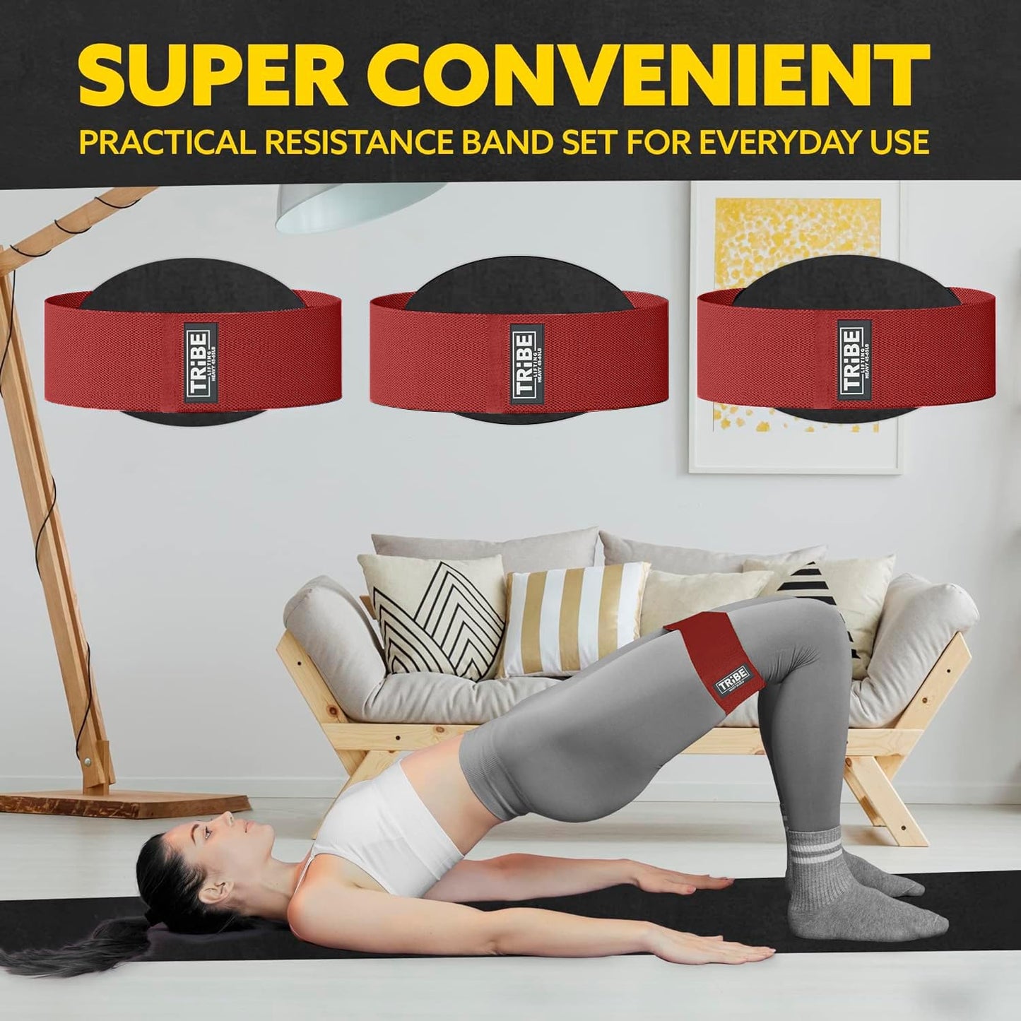 Woman demonstrating a glute bridge with the Tribe Lifting red premium heavy resistance band during a home workout