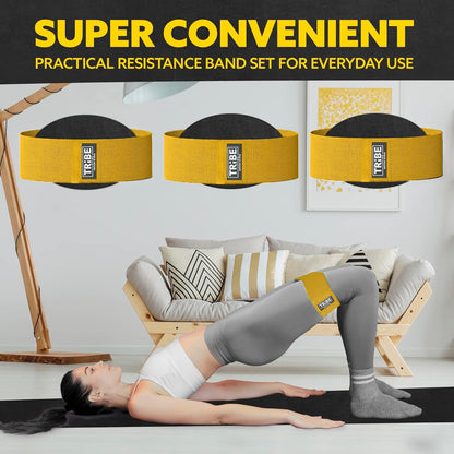 Woman demonstrating a glute bridge with the Tribe Lifting yellow premium medium resistance band during a home workout